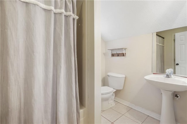 bathroom featuring tile patterned flooring, toilet, sink, and a shower with shower curtain