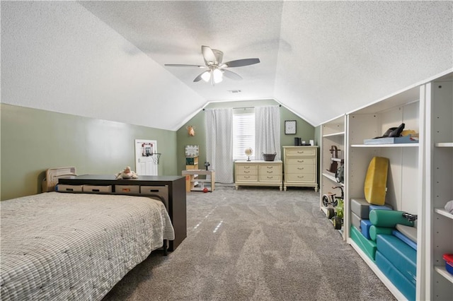 bedroom featuring carpet flooring, a textured ceiling, vaulted ceiling, and ceiling fan