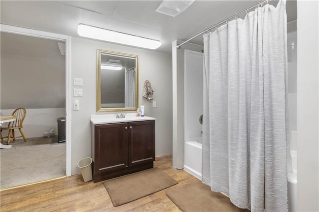 bathroom with vanity, shower / tub combo, and hardwood / wood-style flooring