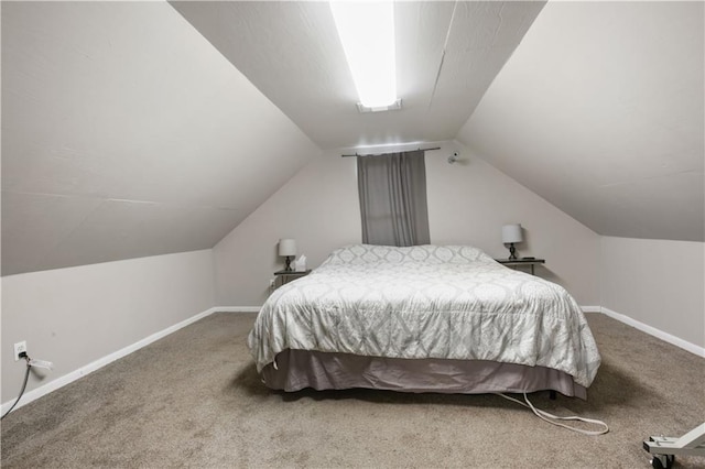 carpeted bedroom featuring vaulted ceiling