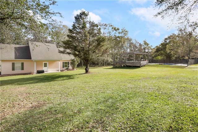 view of yard with a pergola and a deck