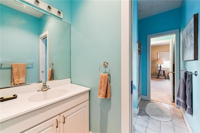 bathroom with tile patterned flooring and vanity