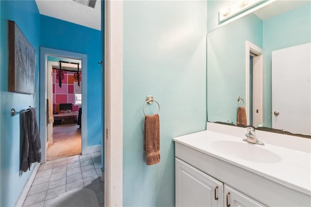 bathroom with tile patterned floors and vanity