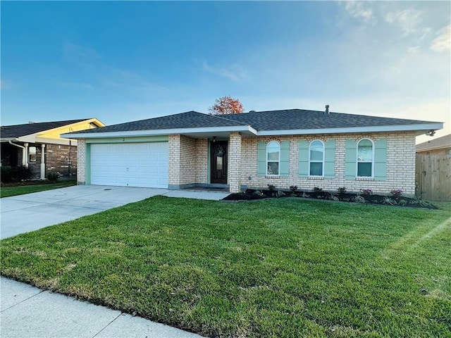 single story home featuring a garage and a front lawn