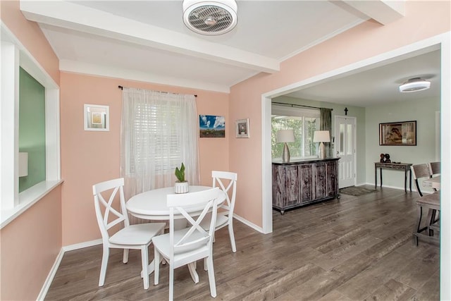 dining area with hardwood / wood-style floors and beamed ceiling