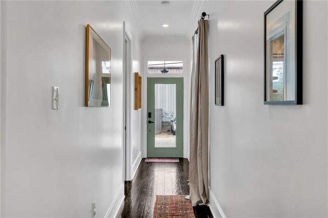 corridor featuring dark hardwood / wood-style flooring and ornamental molding