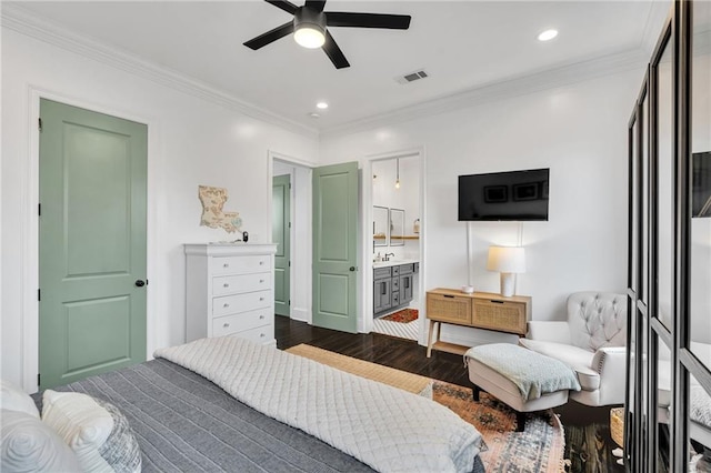 bedroom featuring wood-type flooring, connected bathroom, ceiling fan, and ornamental molding