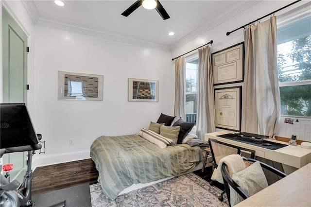 bedroom featuring ceiling fan, crown molding, and wood-type flooring