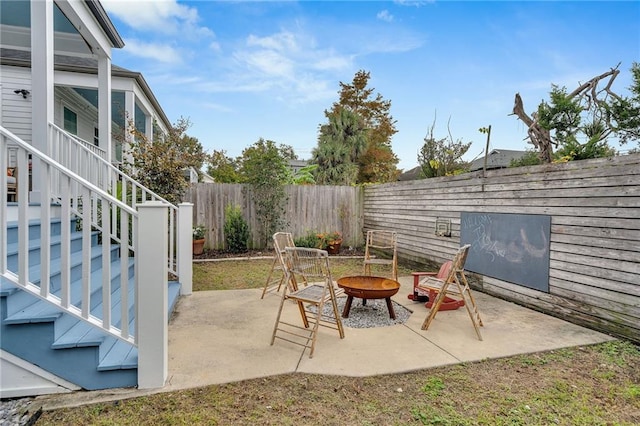 view of patio / terrace featuring an outdoor fire pit