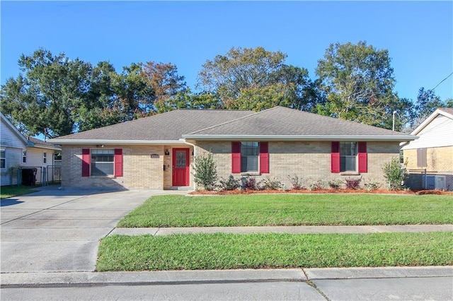 ranch-style home with a front lawn