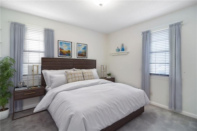 bedroom featuring multiple windows and carpet floors