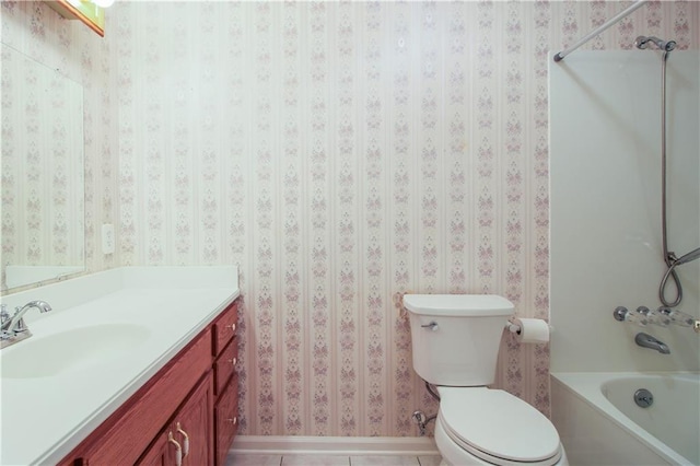 bathroom featuring a washtub, tile patterned floors, vanity, and toilet