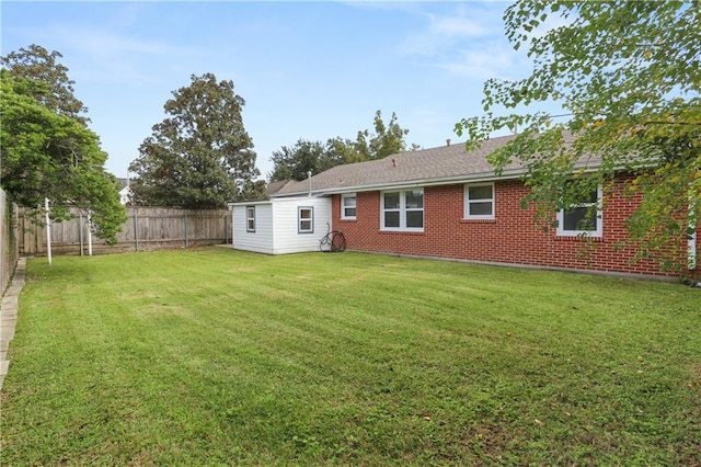 back of house with a yard