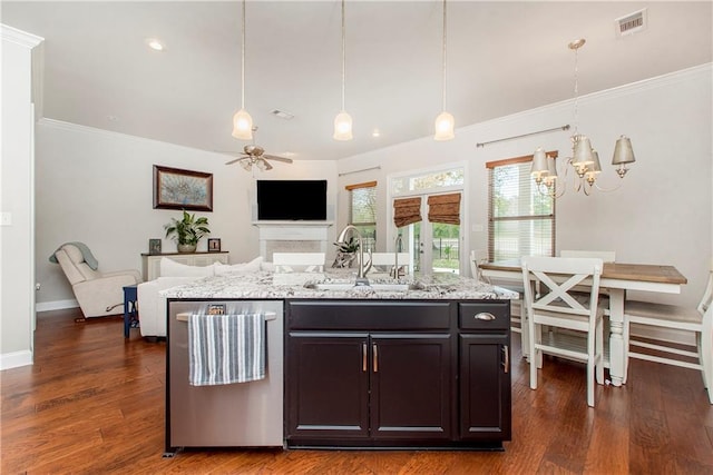 kitchen featuring crown molding, a sink, open floor plan, dishwasher, and visible vents