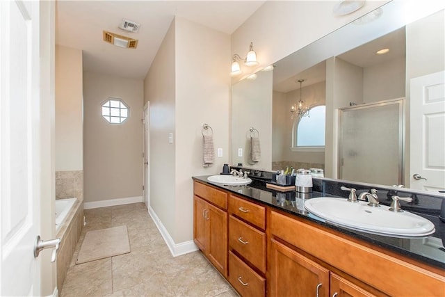 full bath with a healthy amount of sunlight, a sink, and a stall shower
