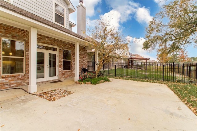 view of patio / terrace with fence and french doors