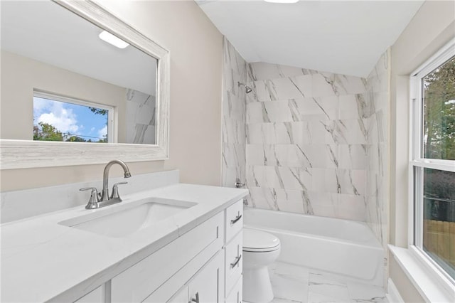 full bathroom featuring vanity, plenty of natural light, tiled shower / bath, and toilet