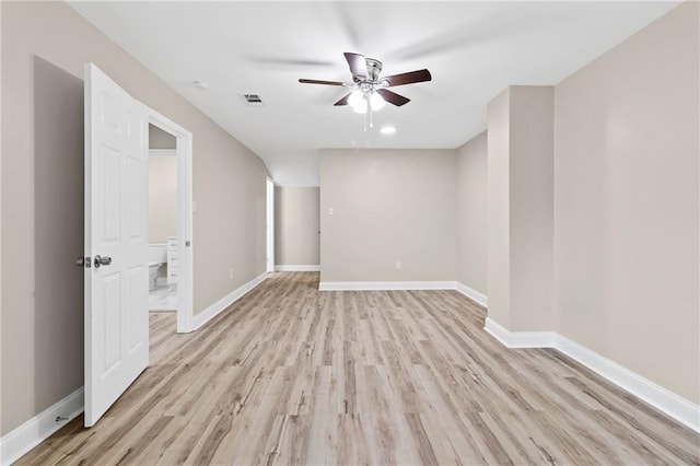 unfurnished room featuring ceiling fan and light wood-type flooring