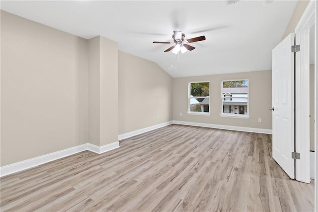 unfurnished living room featuring ceiling fan, light hardwood / wood-style floors, and lofted ceiling