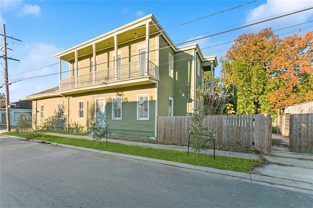 view of front of property with a balcony