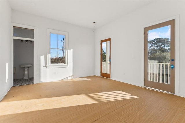 interior space featuring hardwood / wood-style flooring and a healthy amount of sunlight