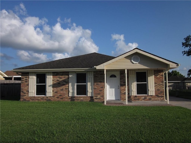 ranch-style home featuring a front yard