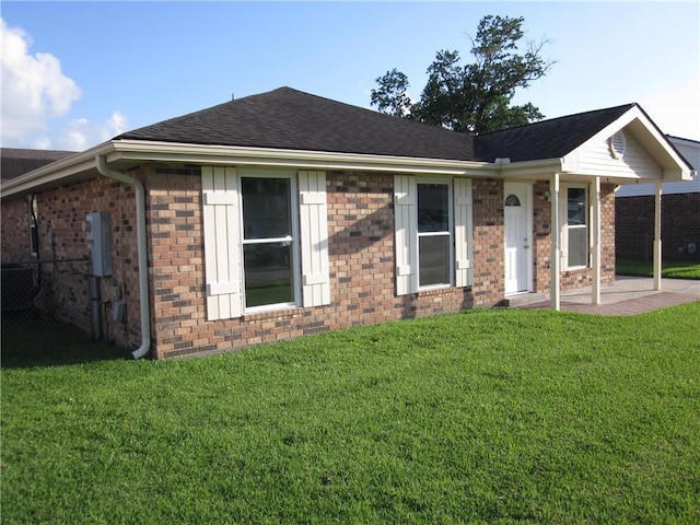 ranch-style house with a patio and a front yard