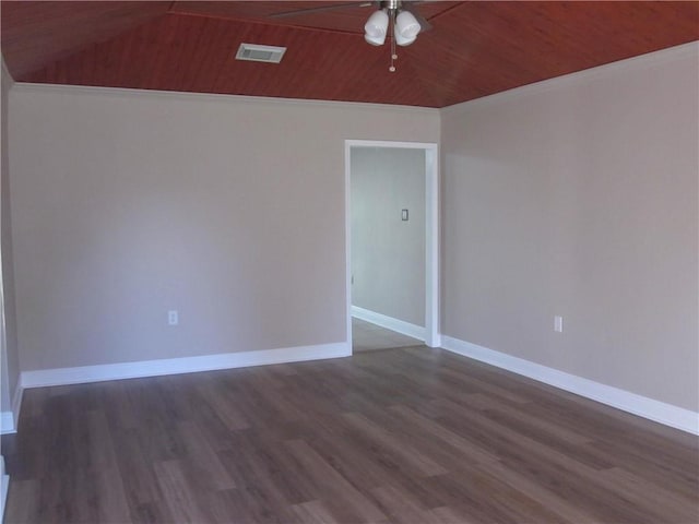 empty room featuring dark hardwood / wood-style floors, vaulted ceiling, ceiling fan, and wooden ceiling