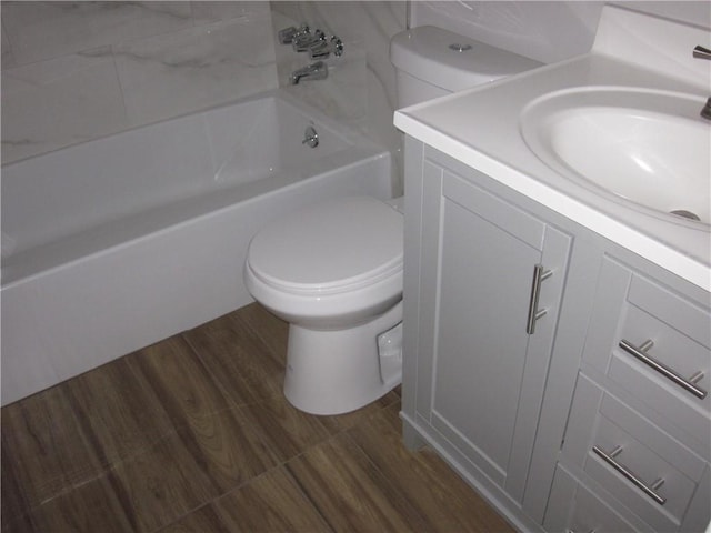 full bathroom featuring bathtub / shower combination, hardwood / wood-style floors, vanity, and toilet