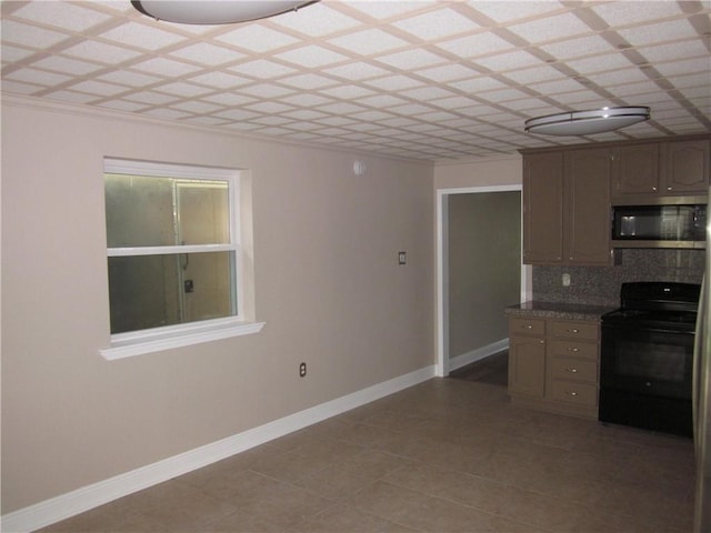 kitchen with decorative backsplash and black stove