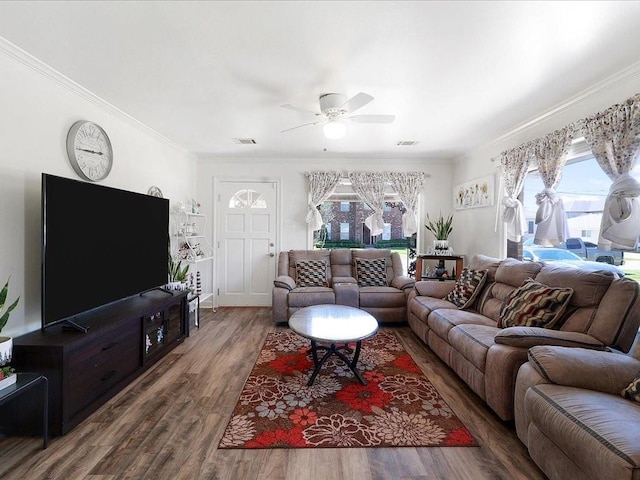 living room featuring crown molding, ceiling fan, and hardwood / wood-style flooring