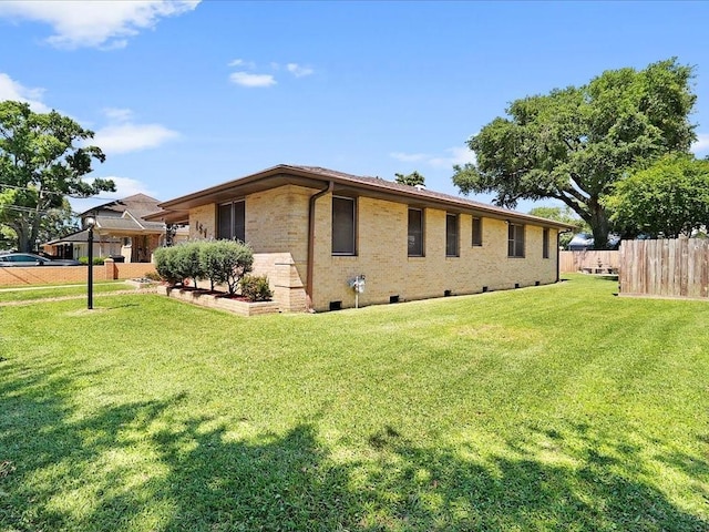 view of home's exterior featuring a yard