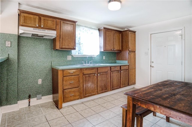 kitchen featuring light tile patterned floors, tasteful backsplash, and sink