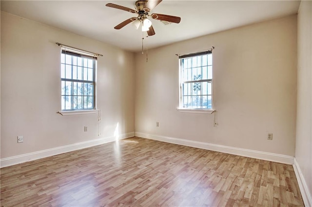 unfurnished room featuring ceiling fan and light hardwood / wood-style flooring