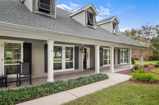 entrance to property featuring french doors and covered porch