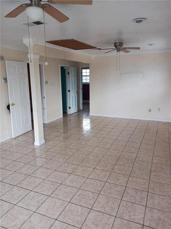 tiled empty room with crown molding