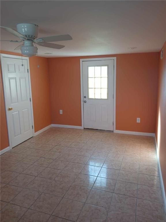 unfurnished room with ceiling fan