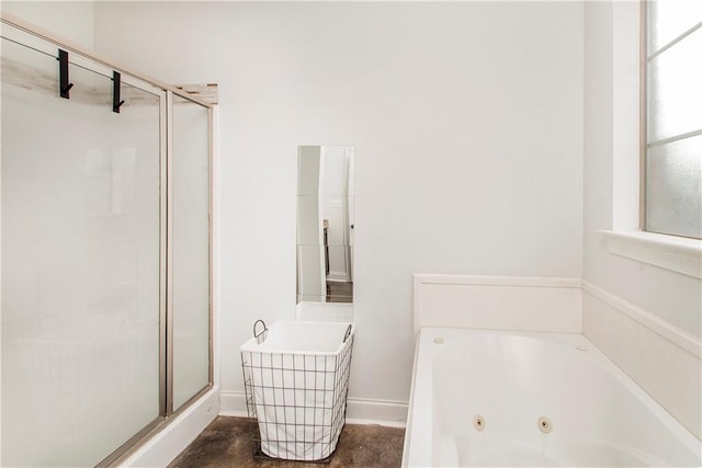 bathroom featuring separate shower and tub