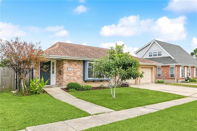 view of front facade with a garage and a front lawn