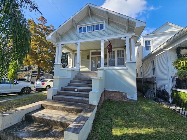 view of front facade with a porch and a front yard