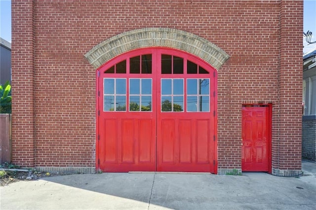 view of exterior entry with a garage