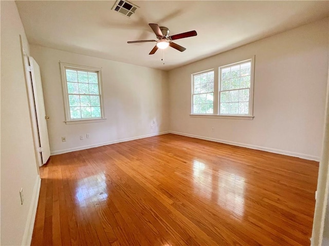 108 N Dr, Covington, LA 70433 - empty room with hardwood / wood-style flooring, ceiling fan, and baseboards