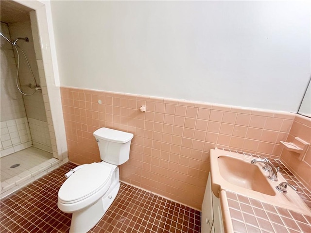 108 N Dr, Covington, LA 70433 - bathroom with wainscoting, toilet, a shower stall, tile walls, and vanity