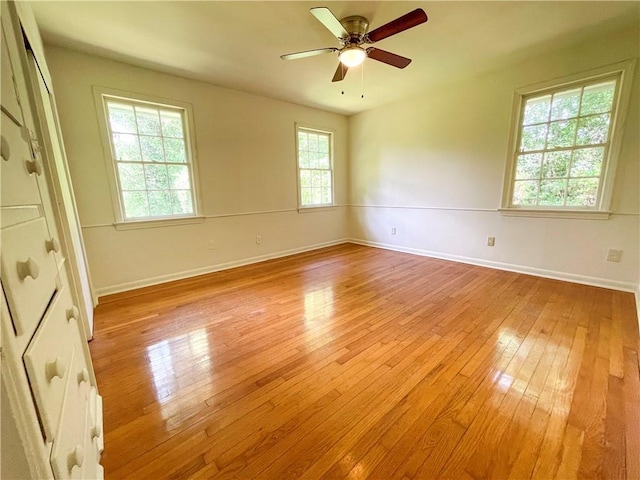 108 N Dr, Covington, LA 70433 - empty room featuring light wood-style flooring, baseboards, and a ceiling fan