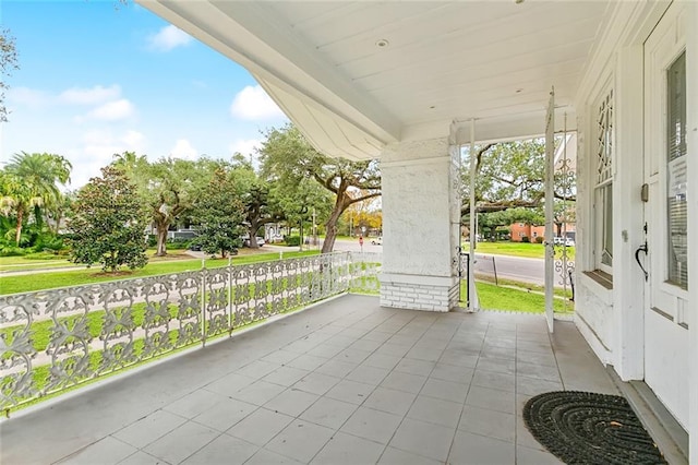 view of patio featuring a porch