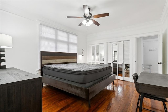 bedroom with ceiling fan and dark hardwood / wood-style floors