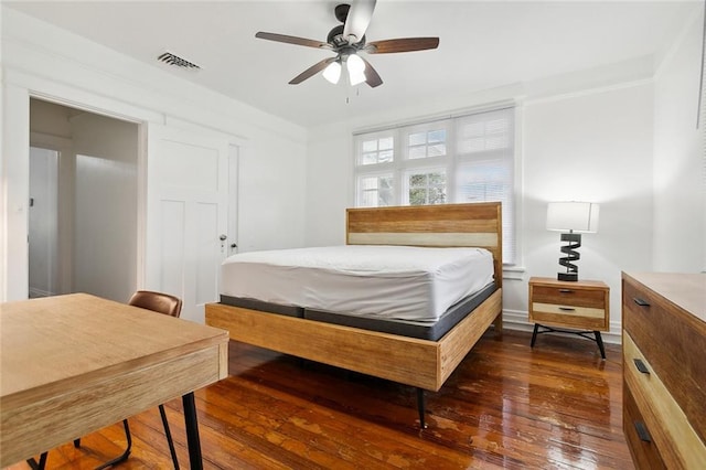 bedroom featuring dark hardwood / wood-style floors and ceiling fan