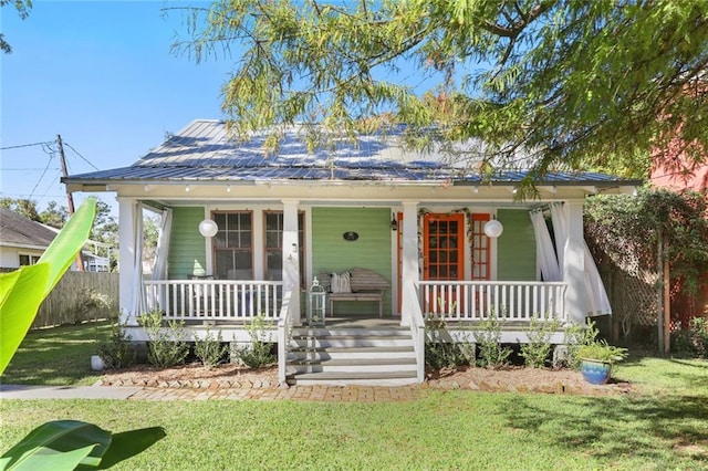 bungalow-style house with a porch and a front yard