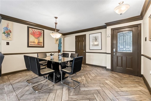 dining area featuring parquet flooring and ornamental molding