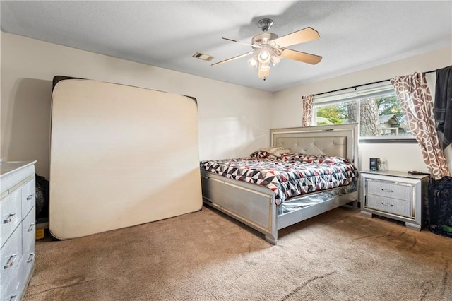 bedroom with light carpet and ceiling fan